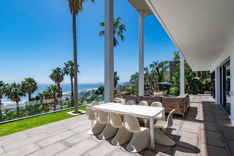 Outdoor dining beside the lawn with a view across the Atlantic