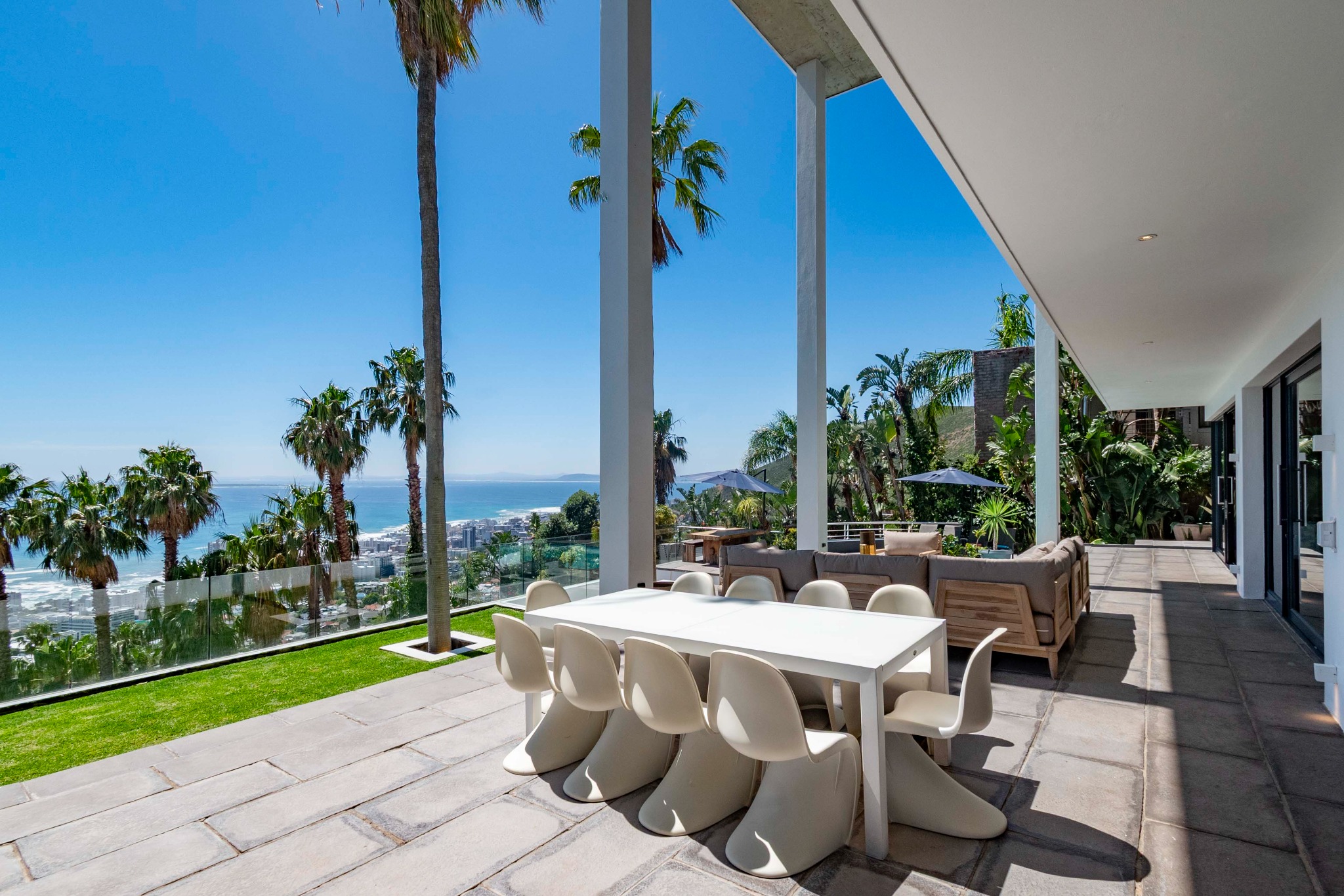 Outdoor dining beside the lawn with a view across the Atlantic